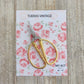 Mini tijera dorada colección